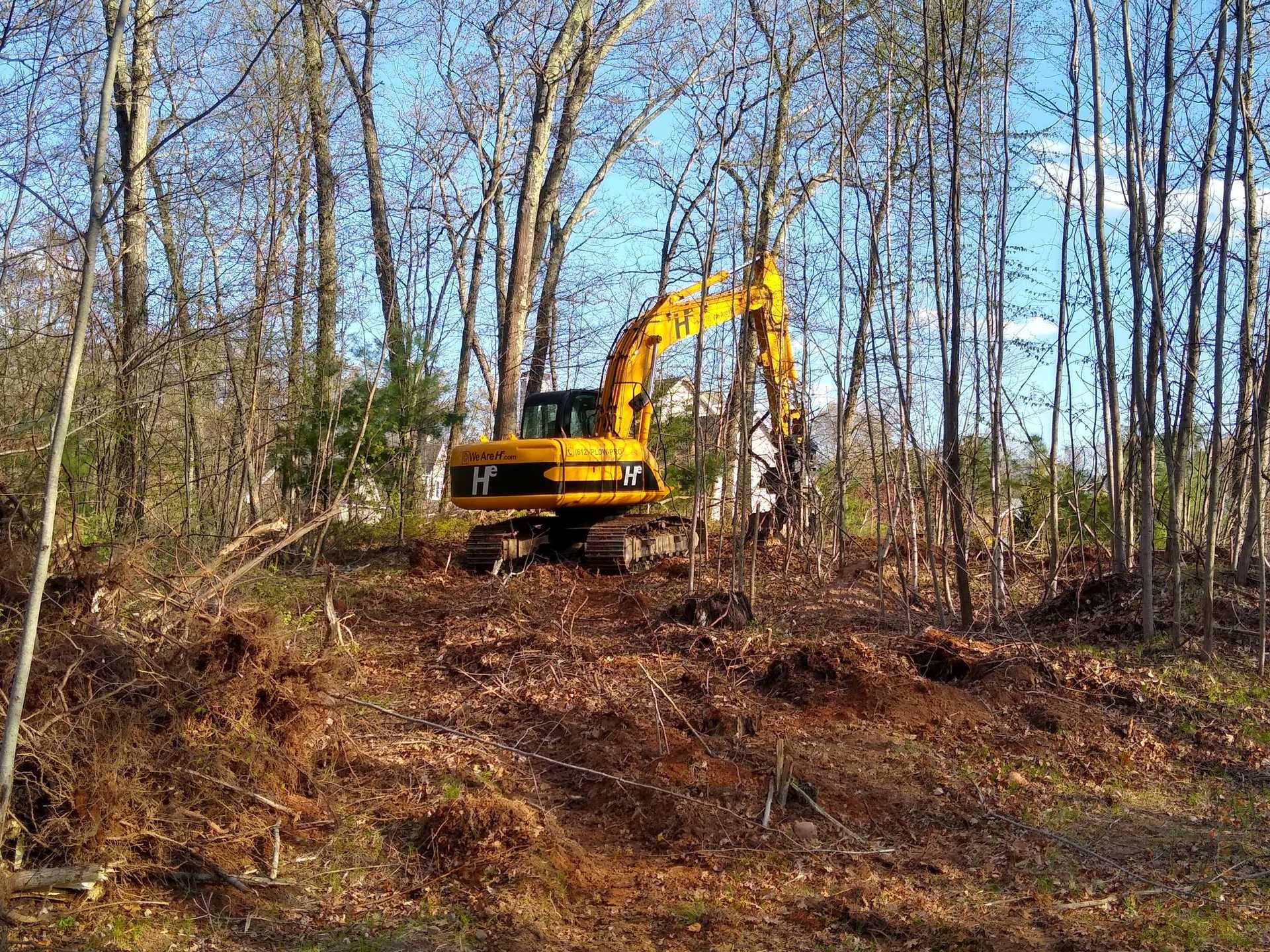 Hunter Environmental Excavator removing trees