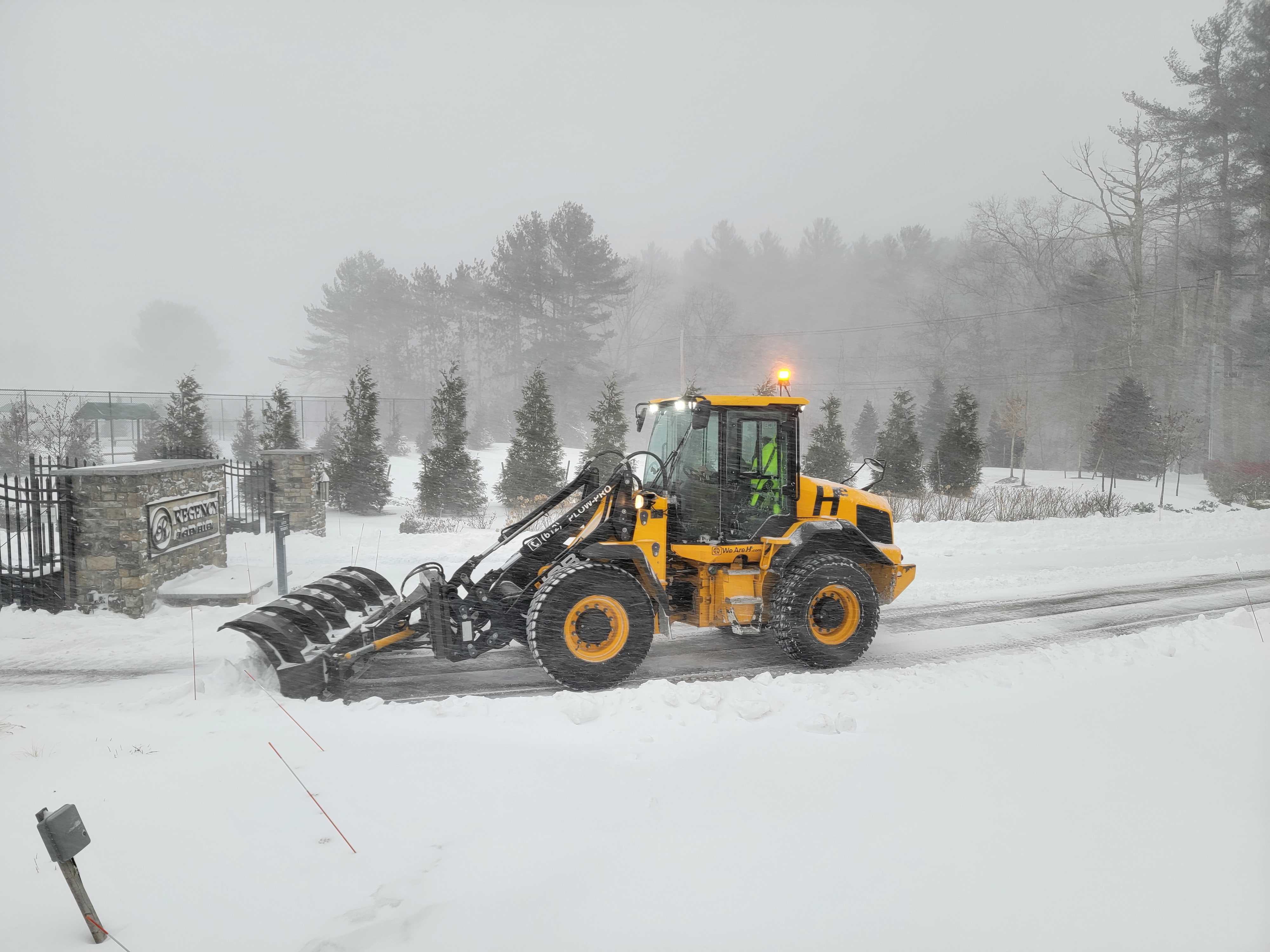 Hunter Environmental plow truck plowing snow